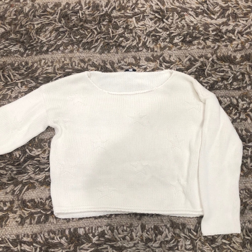 White sweater with star design